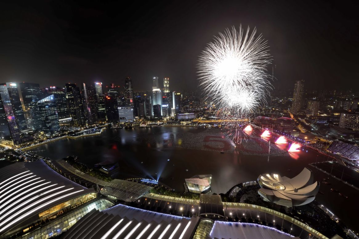 Fireworks burst over Marina Bay in Singapore.