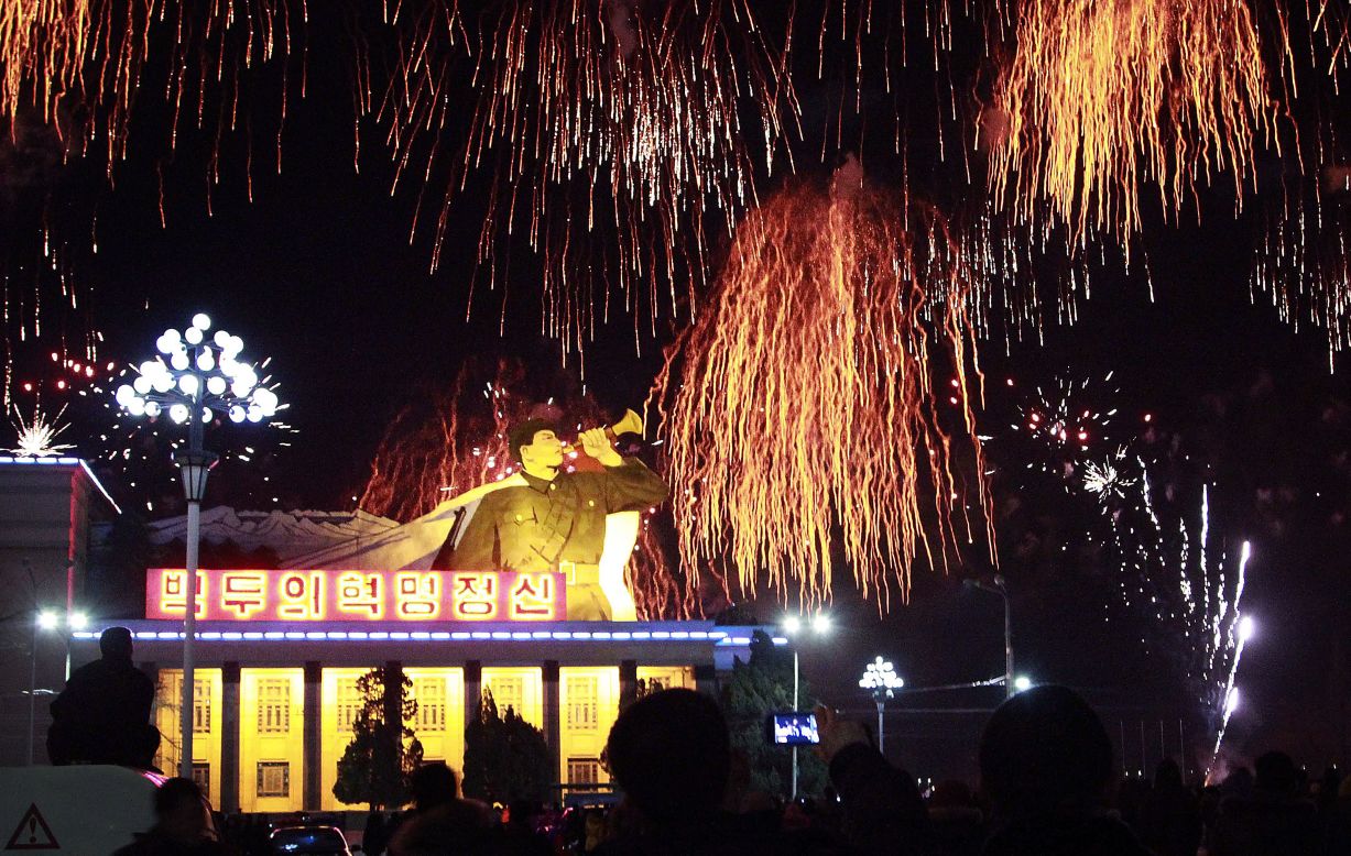 People gather at the Kim Il Sung Square to watch a fireworks display in Pyongyang, North Korea.