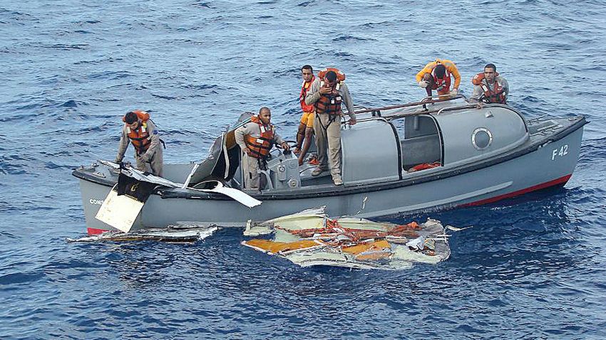 A handout picture from the Brazilian Navy press office shows crew members of the Brazilian Frigate 'Constituicao' on June 7, 2009 recovering debris from Air France flight 447, which crashed into the Atlantic Ocean on June 1.