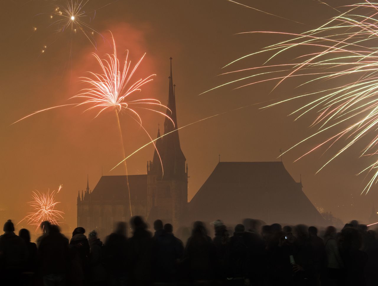 Fireworks light the sky above the medieval St. Mary's Cathedral and St. Severi Church in Erfurt, Germany.