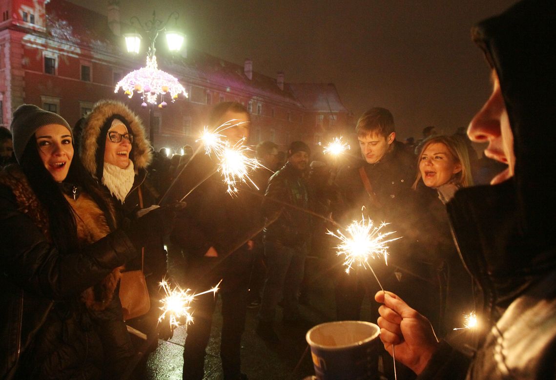 People gather to celebrate the arrival of the new year at Castle Square in Warsaw, Poland.