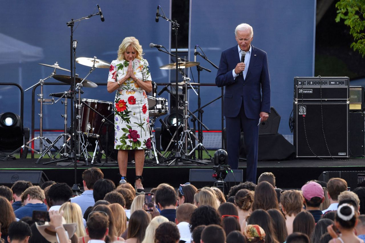 US President Joe Biden and First Lady Jill Biden take a moment of silence for the victims of the Highland Park shooting during a Fourth of July BBQ at the White House in Washington, DC, on Monday.