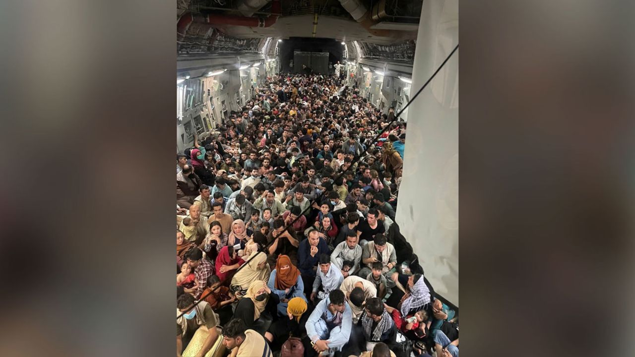 Evacuees crowd the interior of a U.S. Air Force C-17 Globemaster III transport aircraft, carrying some 640 Afghans to Qatar from Kabul, Afghanistan on August 15.