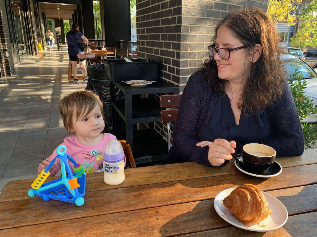 In this photo from a calmer moment a few months earlier, my daughter takes in the sights as we pause for a break at our local coffee shop.