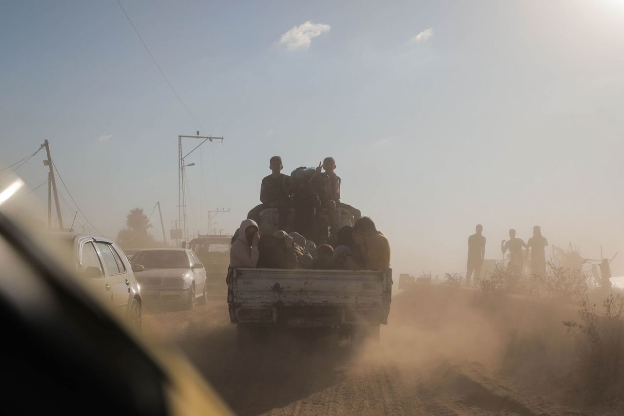 Displaced families from northern and central Gaza evacuate towards southern Gaza on October 13.