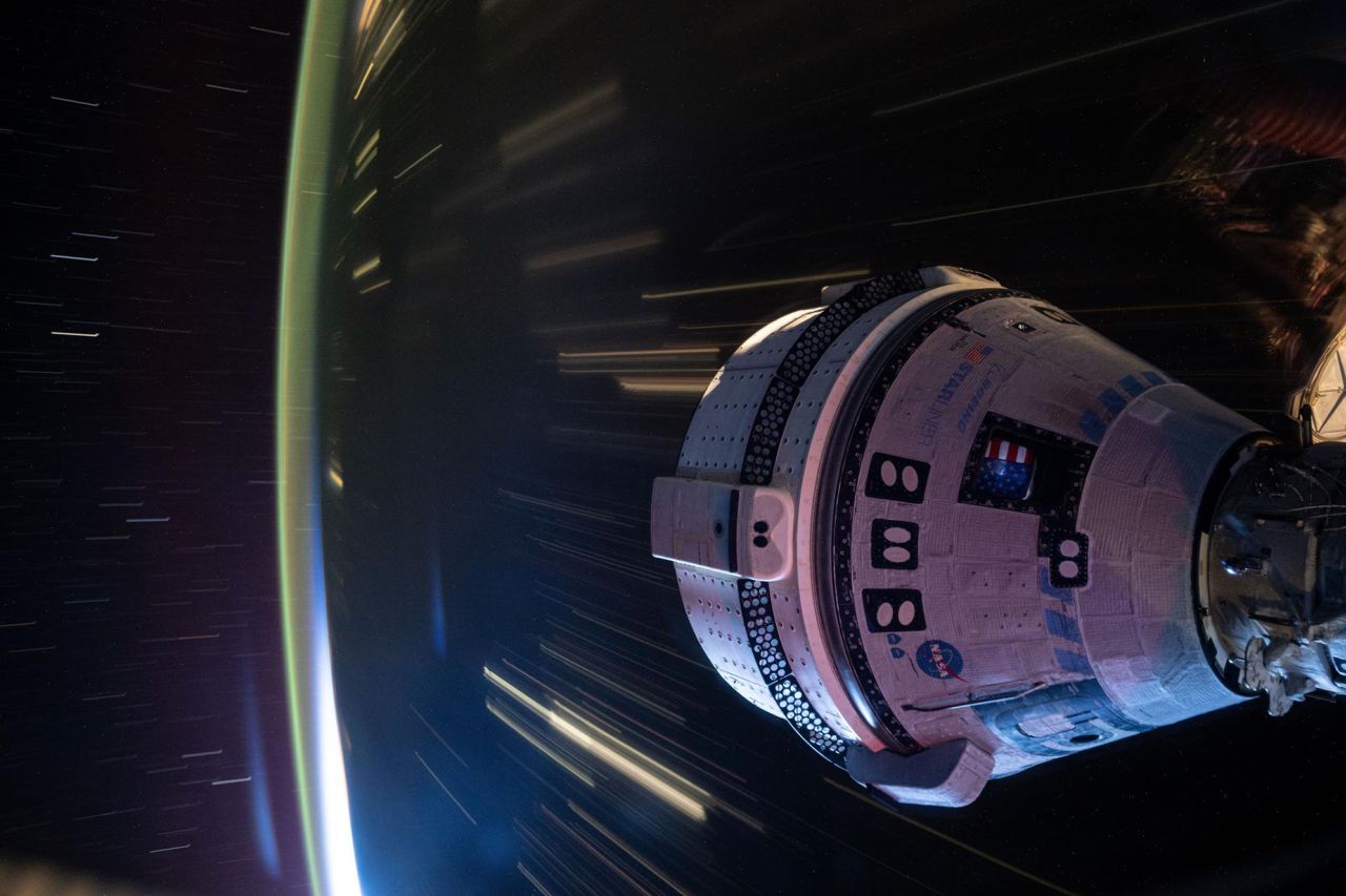 Boeing's Starliner spacecraft is docked to the International Space Station on July 3, 2024. This long-duration photograph was taken at night from the orbital complex as it soared 258 miles above western China. 