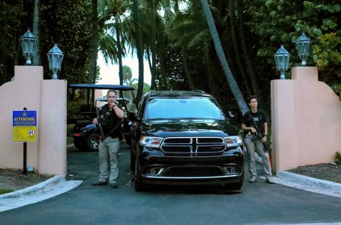 The Secret Service stand at the gate of Mar-a-Lago after the FBI executed a search warrant at former President Donald Trump's residence in Palm Beach, Florida, on August 8. 