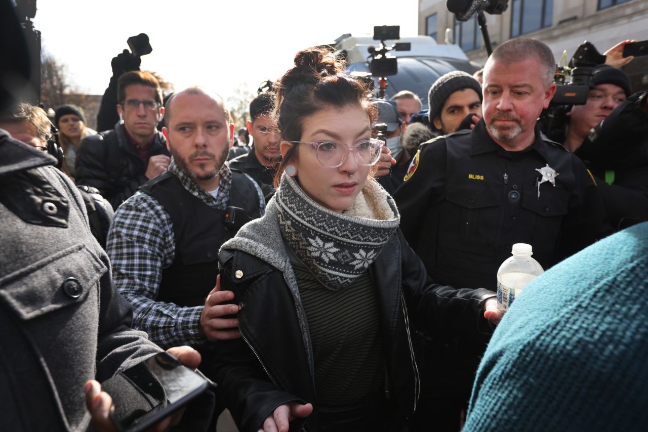 Hannah Gittings, the girlfriend of Anthony Huber, is escorted from the Kenosha County Courthouse after learning that Kyle Rittenhouse was acquitted of all charges on November 19 in Kenosha, Wisconsin.