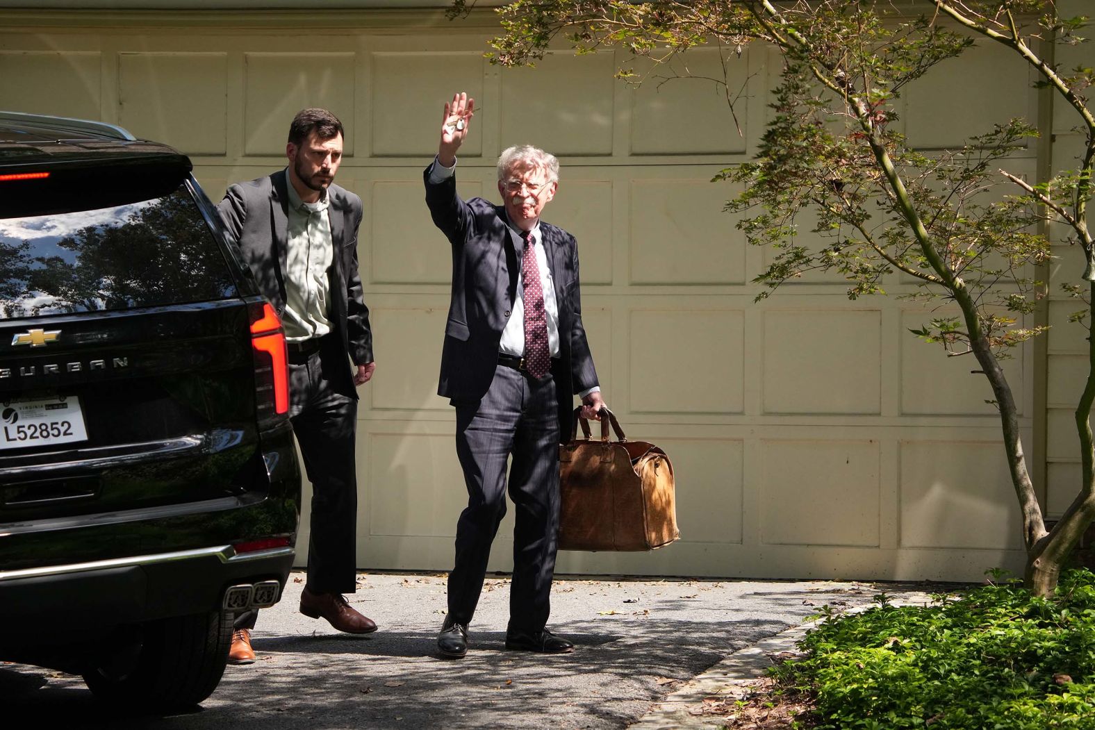 John Bolton, a former national security adviser to US President Donald Trump, waves as he arrives at his Bethesda, Maryland, home, where <a href="index.php?page=&url=https%3A%2F%2Fwww.cnn.com%2F2025%2F08%2F22%2Fpolitics%2Fjohn-bolton-fbi-search">the FBI was conducting a court-authorized search</a> on Friday, August 22. Bolton’s home and office were searched as part of a renewed investigation into whether he disclosed classified information in his 2020 book, according to two people familiar with the matter. Bolton served as Trump’s national security adviser in his first term, but the president fired him in 2019 and the two have been sharply at odds ever since.