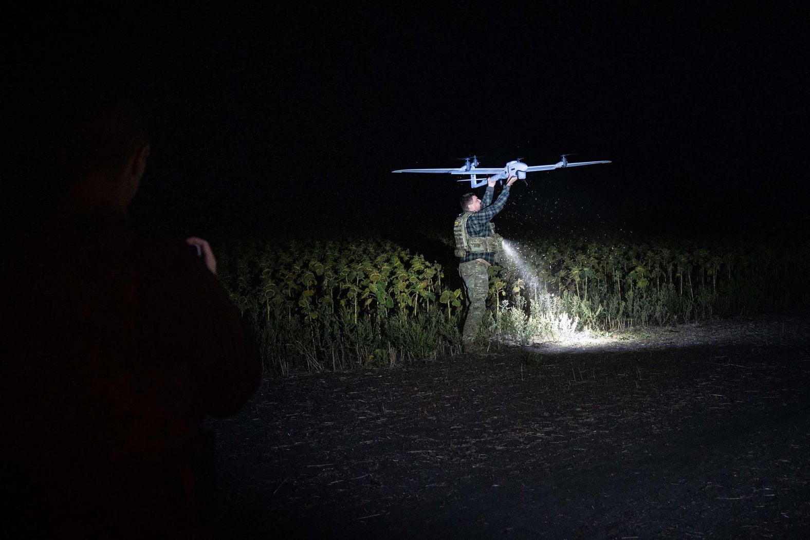 A member of the Ukrainian National Police handles a reconnaissance drone during a mission to look for Russian forces and logistical facilities in the country’s Donetsk region on Thursday, September 11.
