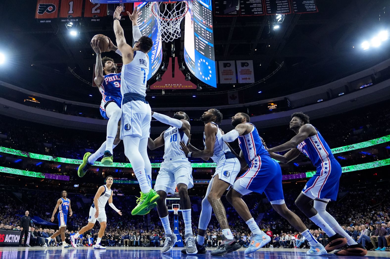 The Philadelphia 76ers' Kelly Oubre Jr. is defended by the Dallas Mavericks’ Dwight Powell during an NBA basketball game in Philadelphia on Monday, February 5.