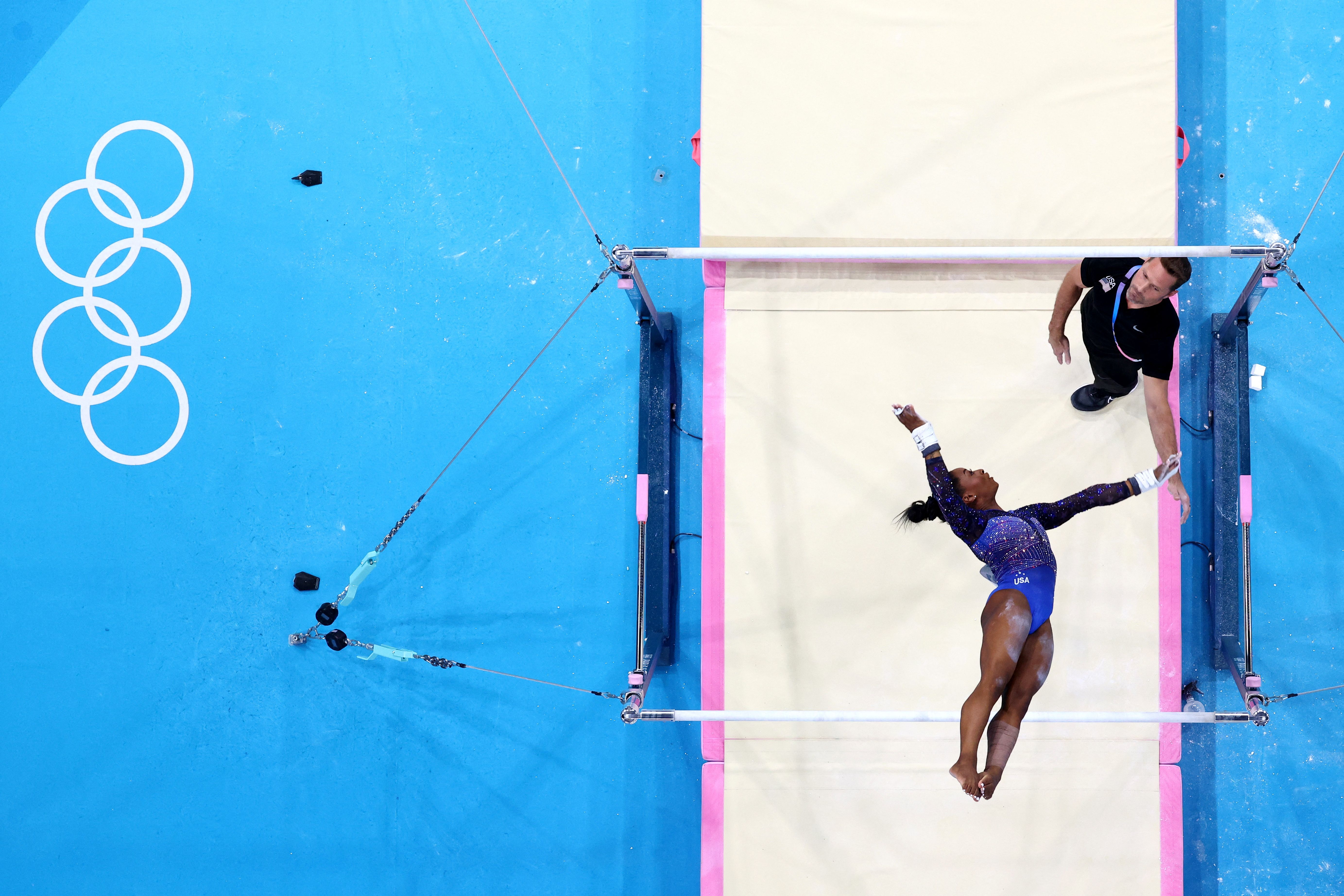 Biles fell behind after the uneven bars, but her overall score was still close to Andrade.