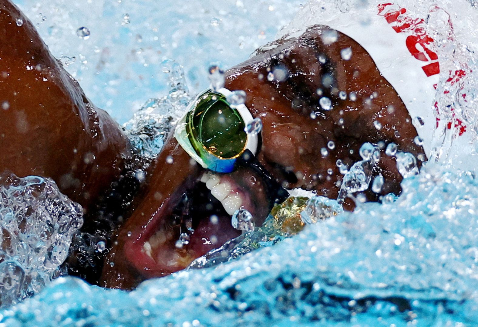 Goggles slide down the face of Congo's Vanessa Bobimbo as she swims in the 50-meter freestyle at the Paris Olympics on Saturday, August 3.