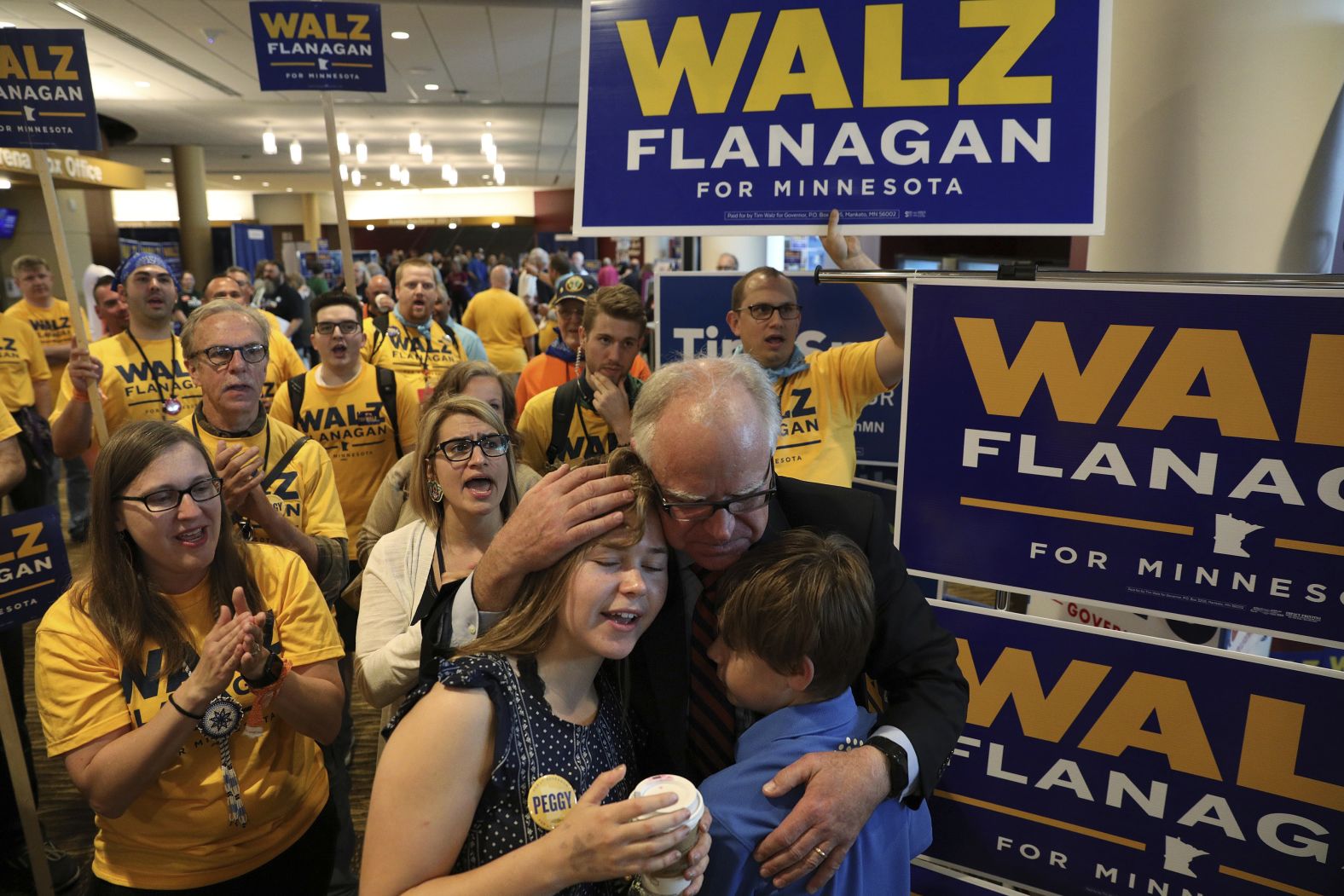 Walz, a candidate for governor, hugs his children, Hope and Gus, following a campaign rally in Rochester, Minnesota, in 2018. Walz would go on to win that election to succeed outgoing Democratic Gov. Mark Dayton.