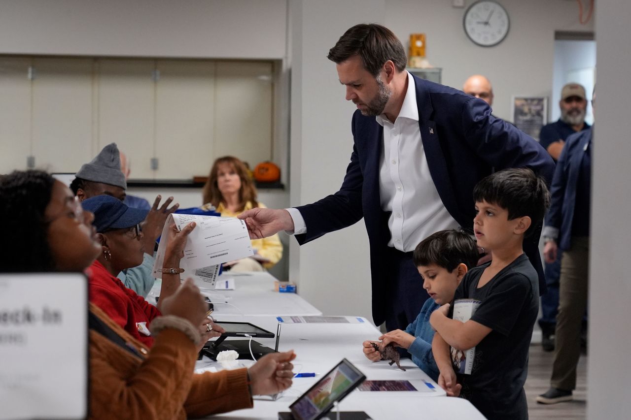 Ohio Senator and Republican Vice Presidential candidate JD Vance arrives to vote with his children in Cincinnati on Tuesday.