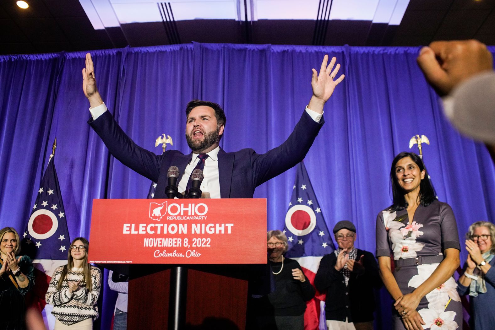 Vance speaks to supporters at an election-night watch party in Columbus, Ohio, in November 2022. His wife, Usha, is on the right. Vance defeated US Rep. Tim Ryan in the race.