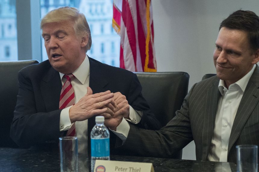 Peter Thiel, a co-founder of Palantir, with Trump in 2016.