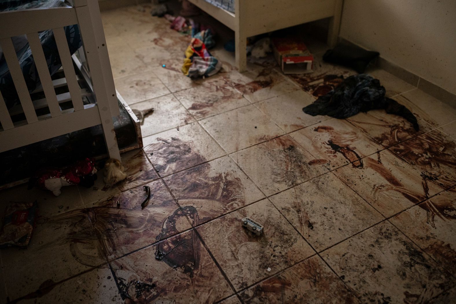 The floor of a child’s bedroom is stained with blood in Be’eri, an Israeli kibbutz near the Gaza border, on October 17. “It’s difficult to imagine or know exactly what happened in that room, but the signs of violence were indisputable,” photographer Tamir Kalifa said.