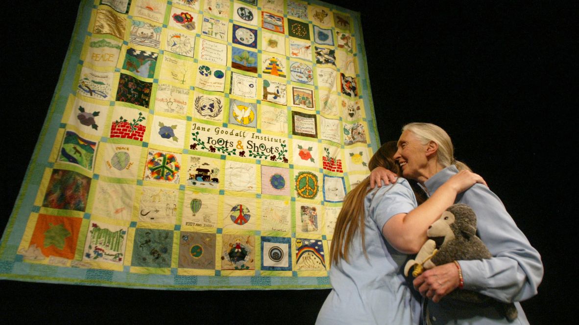 Goodall hugs Bryana Schroder of the Davis/Sacramento branch of Roots & Shoots after delivering a speech in Chico, California, in 2005. In 1991, Goodall began the Roots & Shoots environmental program for young people.