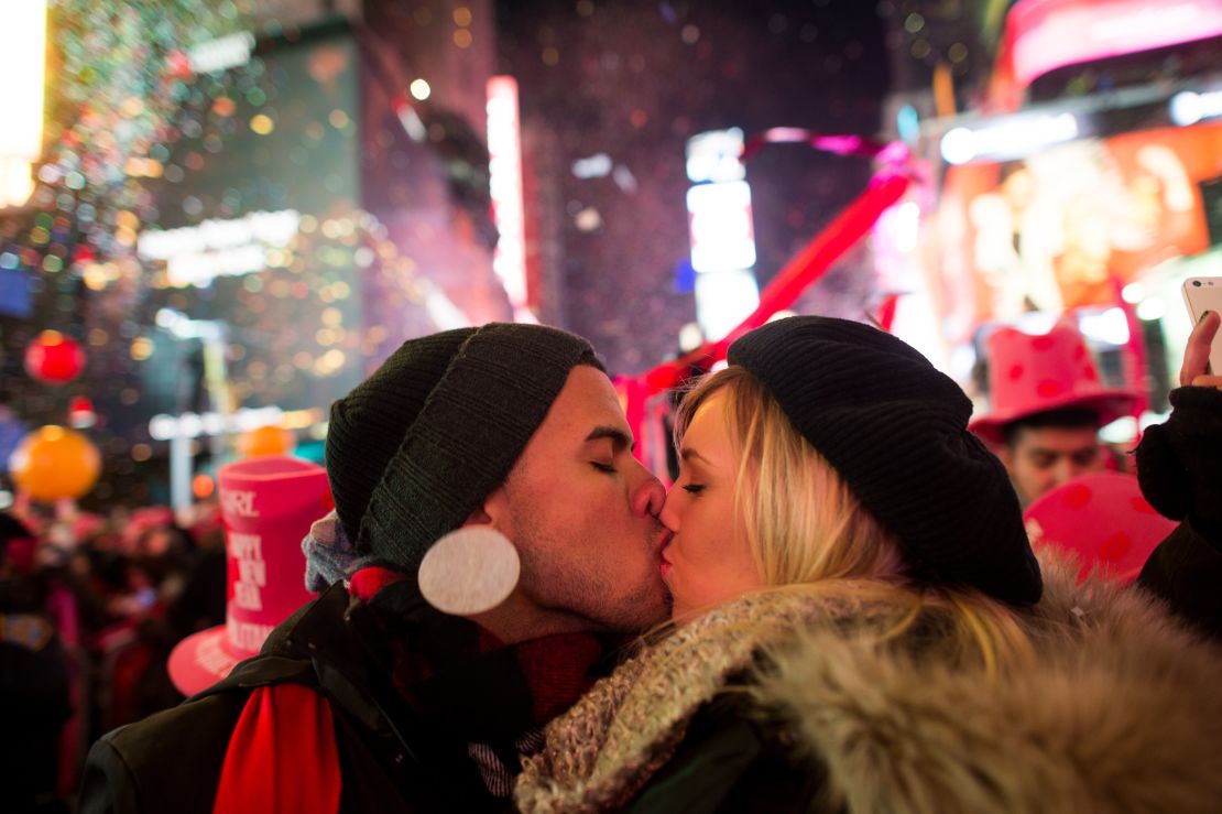 Angel Garcia and Rhea Coulson, of Florida, kiss at midnight as they celebrate the new year in Times Square in New York City.