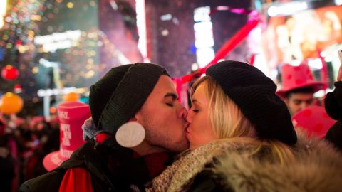 Angel Garcia and Rhea Coulson, of Florida, kiss at midnight as they celebrate the new year in Times Square in New York City.