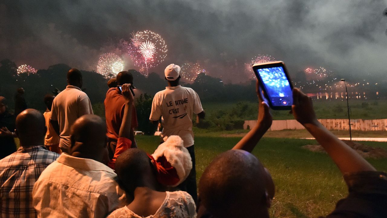 Fireworks illuminate the night sky over the Ebrie Lagoon in Abidjan, Ivory Coast.