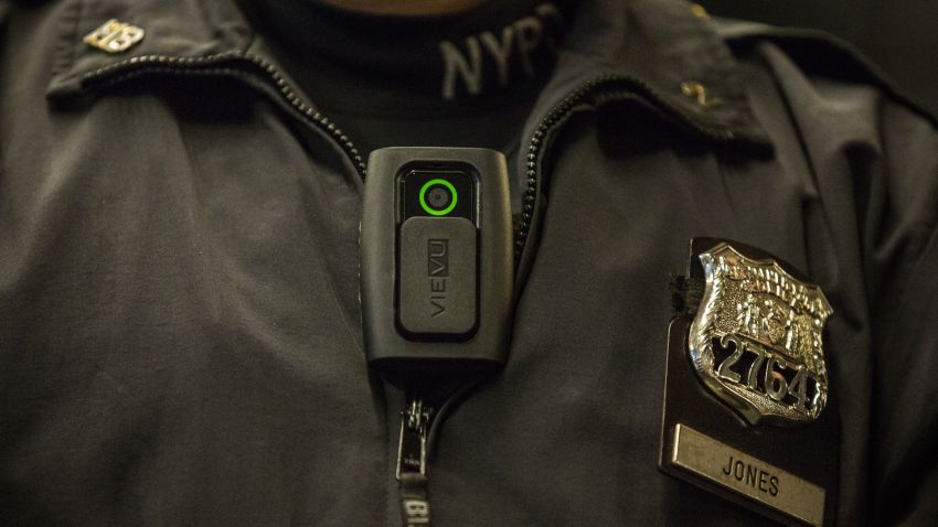 New York Police Department (NYPD) Officer Joshua Jones demonstrates how to use and operate a body camera during a press conference on December 3, 2014 in New York City.  (Photo by Andrew Burton/Getty Images)