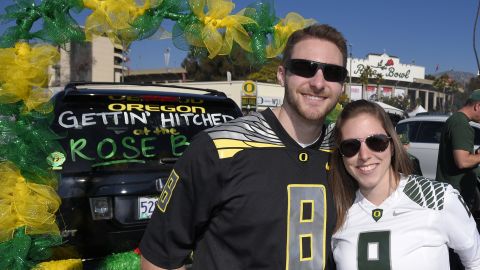 Oregon fans Steve Twomey and Lisa DeFluri pose for a photo at the Rose Bowl.