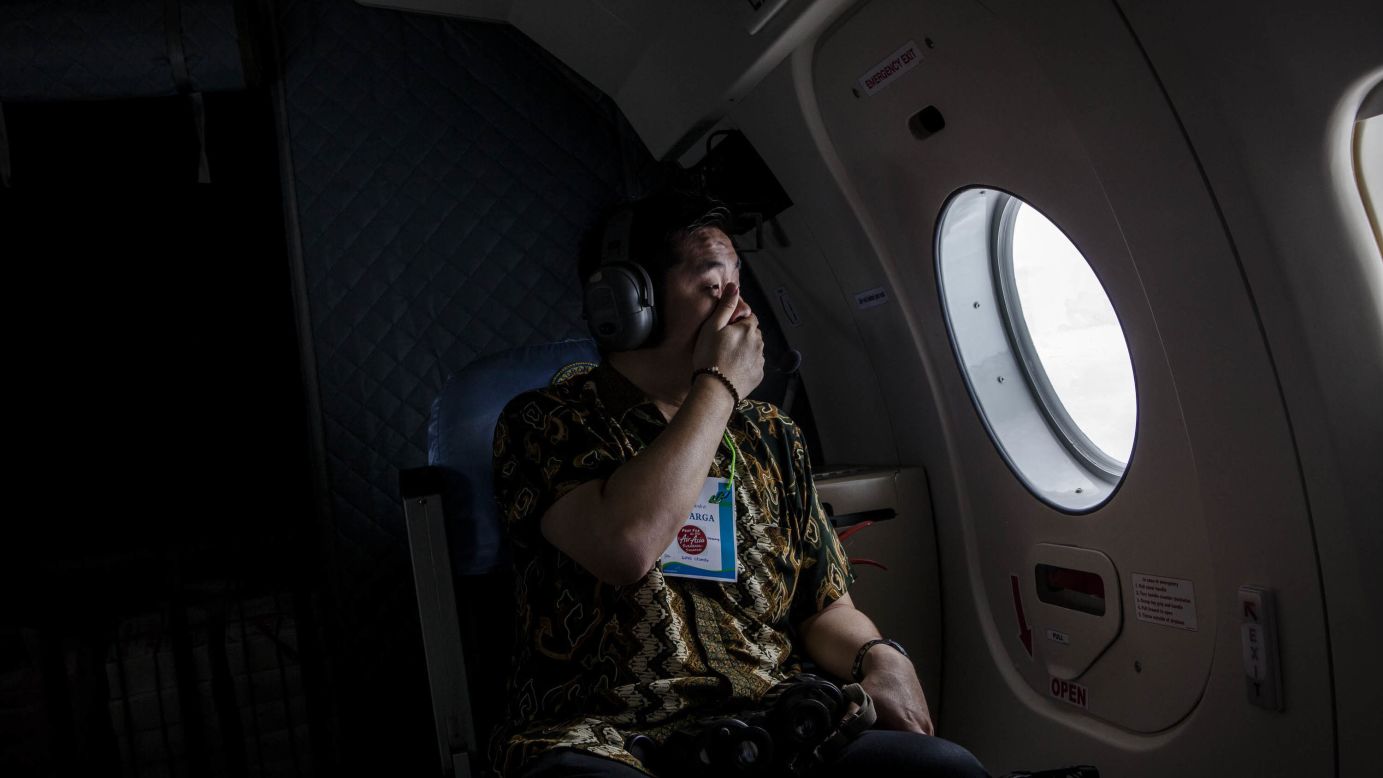 A relative of a missing passenger looks out over the Java Sea during <a href="http://www.cnn.com/2014/12/28/asia/gallery/airasia-missing-plane/index.html" target="_blank">the search for AirAsia Flight QZ8501</a> on Tuesday, December 30. Search teams <a href="http://www.cnn.com/2015/01/01/world/asia/airasia-disaster/index.html" target="_blank">found debris and some bodies in the water</a> two days after the plane took off from Surabaya, Indonesia. It was carrying 155 passengers and seven crew members. 