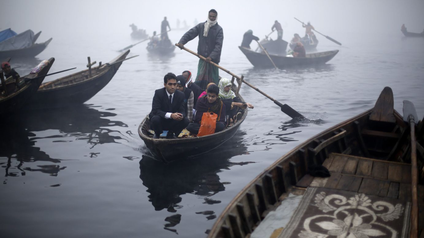 People are rowed across the Buriganga River in Dhaka, Bangladesh, on Monday, December 29.