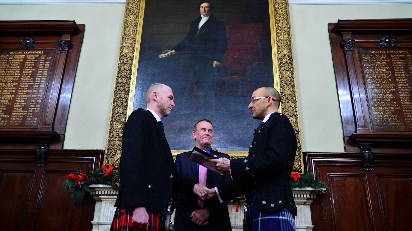 Joe Schofield, right, and Malcolm Brown are married in Glasgow, Scotland, on Wednesday, December 31. It was one of the first same-sex marriages in the country, which changed its law in March.