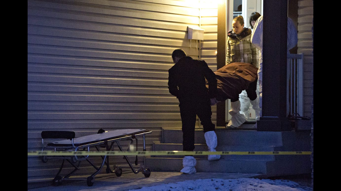 A body is carried out of a home in Edmonton, Alberta, after what police say was a mass killing Tuesday, December 30. A man described by his family as "depressed and overly emotional" <a href="http://www.cnn.com/2014/12/30/world/americas/edmonton-killings/index.html" target="_blank">is suspected of killing eight people</a> before taking his own life, police said.