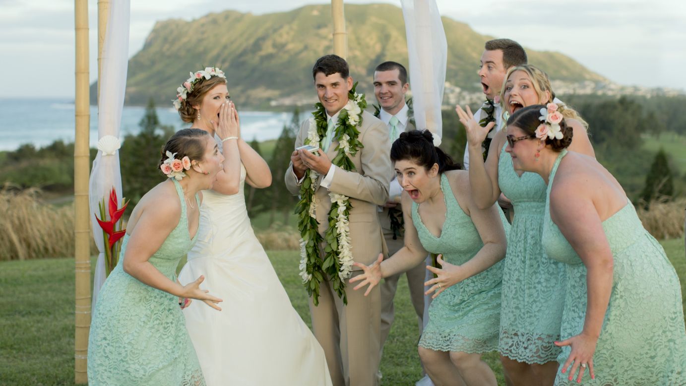 Natalie Heimel, second from left, and her new husband Edward Mallue Jr. react with their wedding party after President Obama called them Sunday, December 28, in Kaneohe Bay, Hawaii. Obama was calling to apologize to the newlyweds because his golf outing <a href="http://www.cnn.com/2014/12/29/politics/obama-golf-wedding-hawaii/index.html" target="_blank">forced them to relocate their wedding. </a>