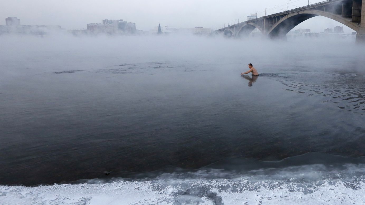 Vladimir Shcherba takes a dip in the Yenisei River in Krasnoyarsk, Russia, on Tuesday, December 30. The air temperature was minus-23 degrees Celsius (minus-9 Fahrenheit).