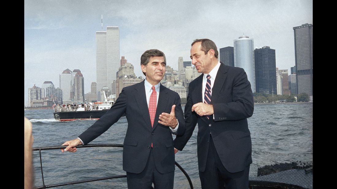 Democratic presidential candidate Michael Dukakis, left, and Cuomo talk on the ferry back to Manhattan on September 4, 1988, after attending ceremonies on Ellis Island, paying tribute to the 17 million immigrants who passed through there. 