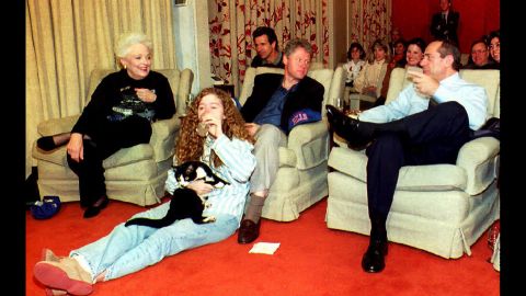 U.S. President Bill Clinton, center, chats with Cuomo and Texas Gov. Ann Richards, while Chelsea Clinton sits on floor, on January 31, 1993, at the White House while watching the  Super Bowl.  