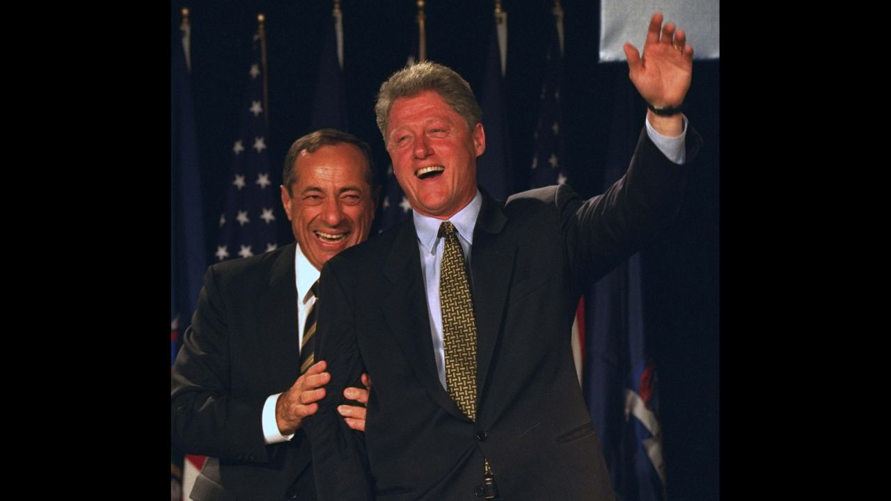 President Bill Clinton waves from the stage with Coumo at the Sheraton New York on October 19, 1994.  