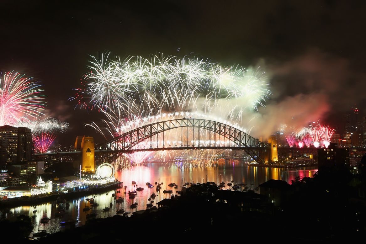 SYDNEY, AUSTRALIA - DECEMBER 31: Fireworks explode off the Sydney Harbour Bridge during the midnight fireworks display on New Year's Eve on Sydney Harbour. 