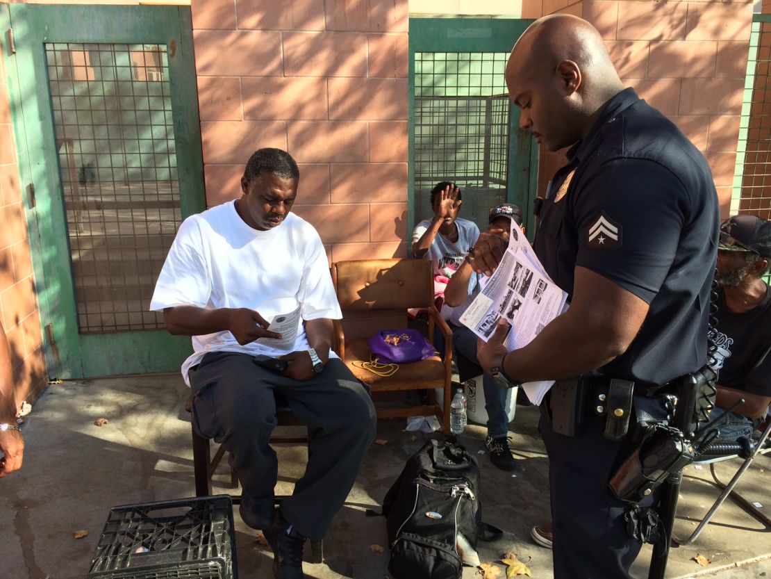 Joseph used to make more arrests: now he also hands out hygeine kits and housing information. 