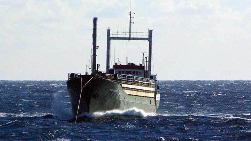 A handout picture taken and released on January 2, 2015 by the Icelandic Coast Guard shows the Ezadeen, a crewless merchant ship with 450 migrants on board, some 40 kilometres (25 miles) off Crotone on Italy's heel. Six coastguard officers were lowered from a helicopter onto the deck of the Ezadeen as it floated some 40 kilometres (25 miles) off Crotone on Italy's heel, the navy said. AFP PHOTO / ICELANDIC COAST GUARD