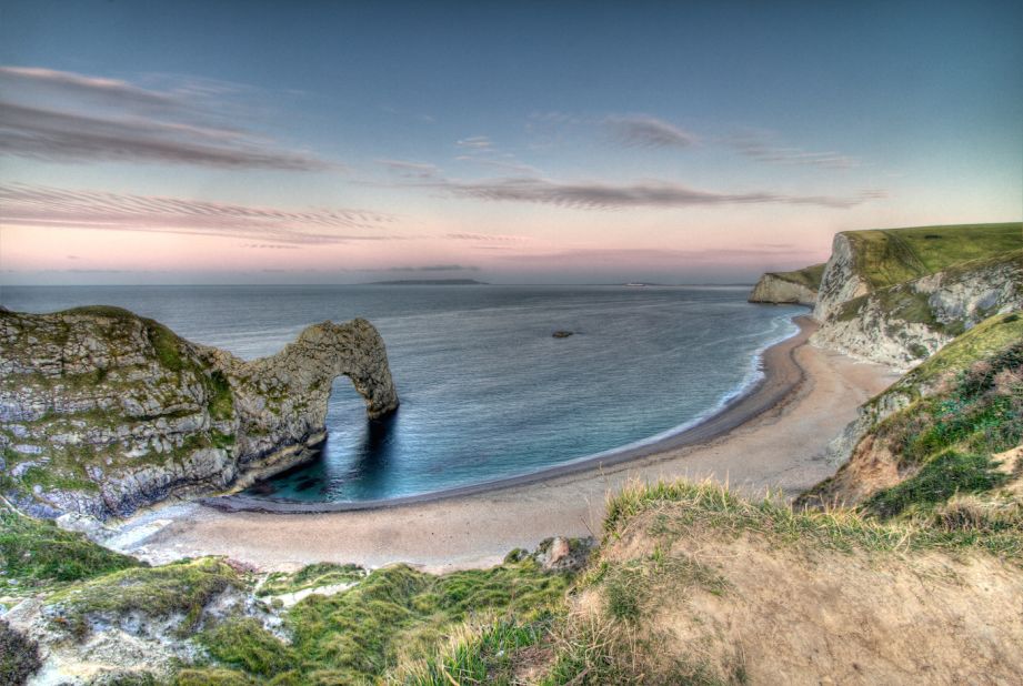 Featuring 240-million-year-old rocks, the South West Coast Path's prehistoric UK cliffs feature spectacular formations like Durdle Door and Ladram Bay. 