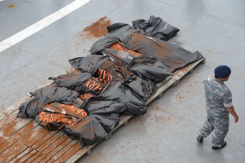 Recovered victims are placed on the deck of the Indonesian ship on January 3. 