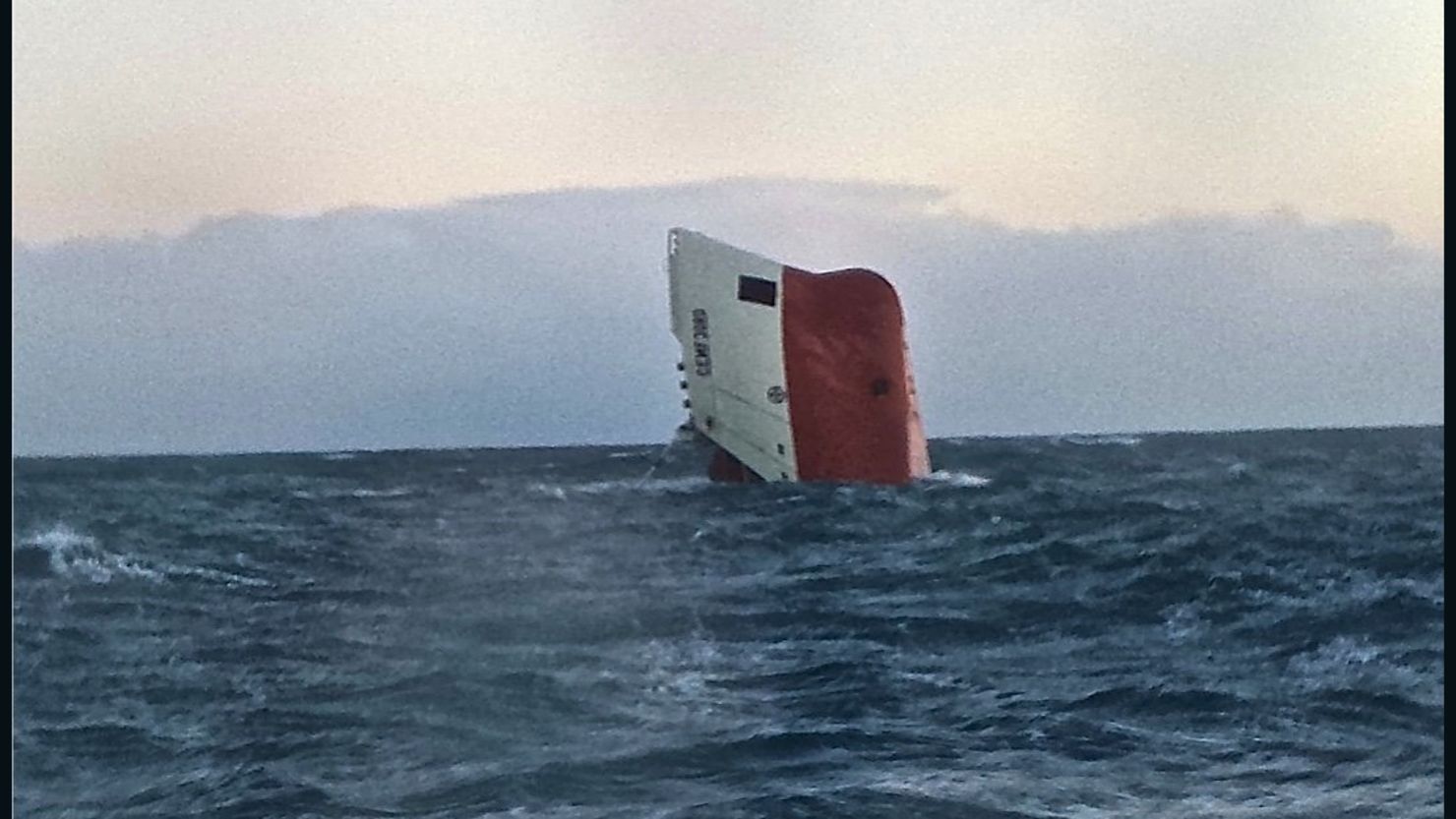A tugboat will remain at the scene to warn other ships in the area before the search resumes at daylight for eight crew missing from the Cemfjord.