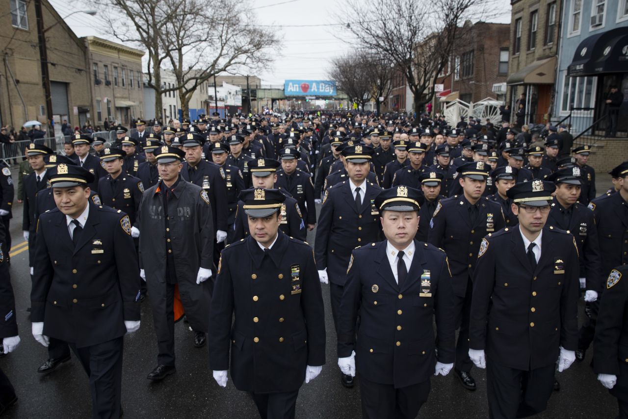 Police officers from across the country arrive at the funeral.