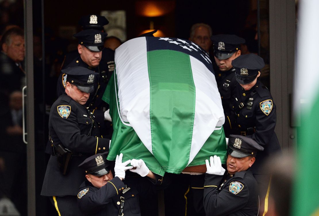 NYPD officers carry the casket of slain officer Wenjian Liu on January 4. 