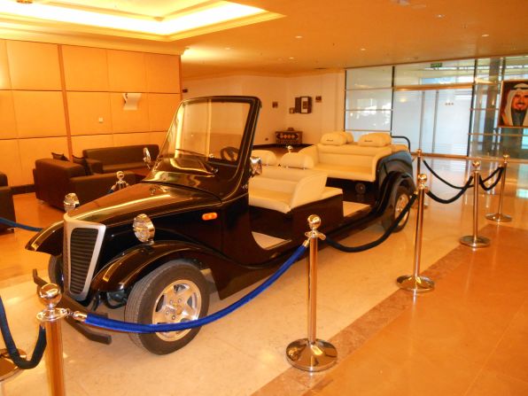 Parked inside the stadium is a custom-made golf cart delivered from the United States. It was made specially to drive the Emir of Kuwait, Sheikh Sabah Al-Ahmad Al-Sabah, and other dignitaries onto the pitch in the event of special occasions. A portrait of the stadium's honoree, the late Sheikh Jaber Al-Ahmad Al-Sabah, hangs in the background. 