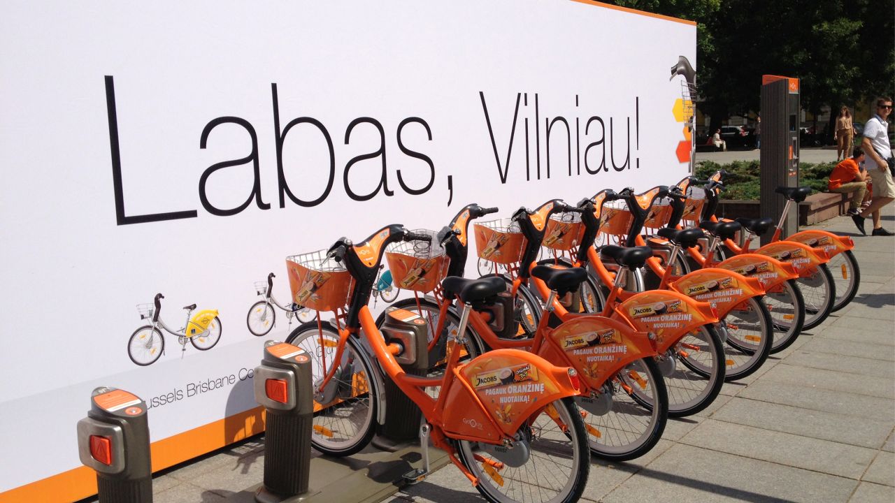 As winter turns to spring, flocks of bright orange bicycles not seen since fall return to line the streets of Vilnius. They're easy to rent.