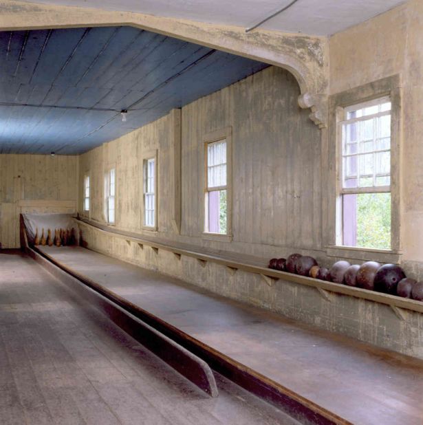 Touted as the country's oldest surviving indoor alley, the 1846 Roseland Cottage bowling alley is no longer open for play, but the National Historic Landmark does offer tours. The bowling alley is located in a carriage barn adjacent to a Gothic Revival cottage built as a country retreat.