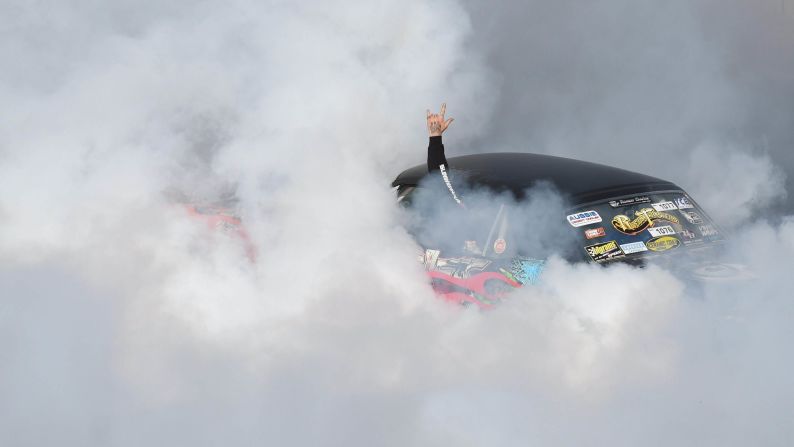 A car performs during a burnout competition held Saturday, January 3, at the Summernats car festival in Canberra, Australia.