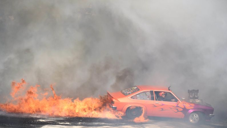 A car catches fire while performing a burnout Saturday, January 3, at the Summernats car festival in Canberra, Australia.